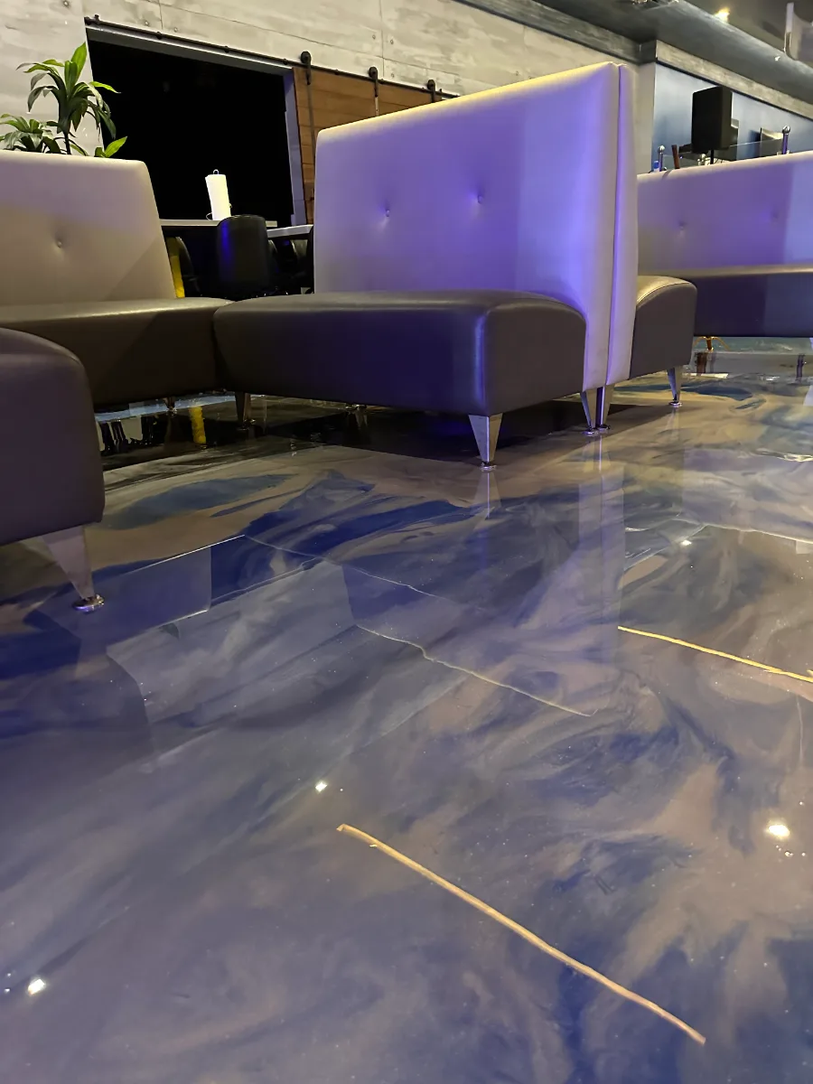 Blue pearl metallic epoxy floor in a lounge